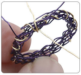 Wire being wrapped around ring